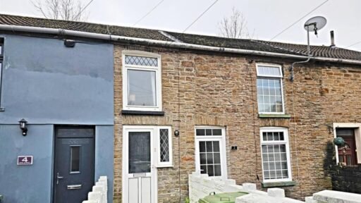A tiny one-bed house in Pontypridd just five feet wide is on sale for £92,000, featuring a compact open-plan lounge, modern shower room and small front and back gardens.