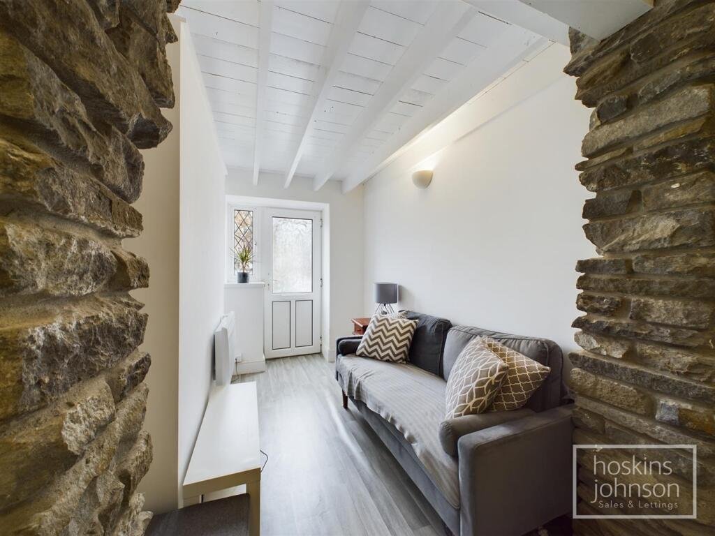 A tiny one-bed house in Pontypridd just five feet wide is on sale for £92,000, featuring a compact open-plan lounge, modern shower room and small front and back gardens.