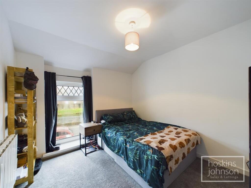 A tiny one-bed house in Pontypridd just five feet wide is on sale for £92,000, featuring a compact open-plan lounge, modern shower room and small front and back gardens.