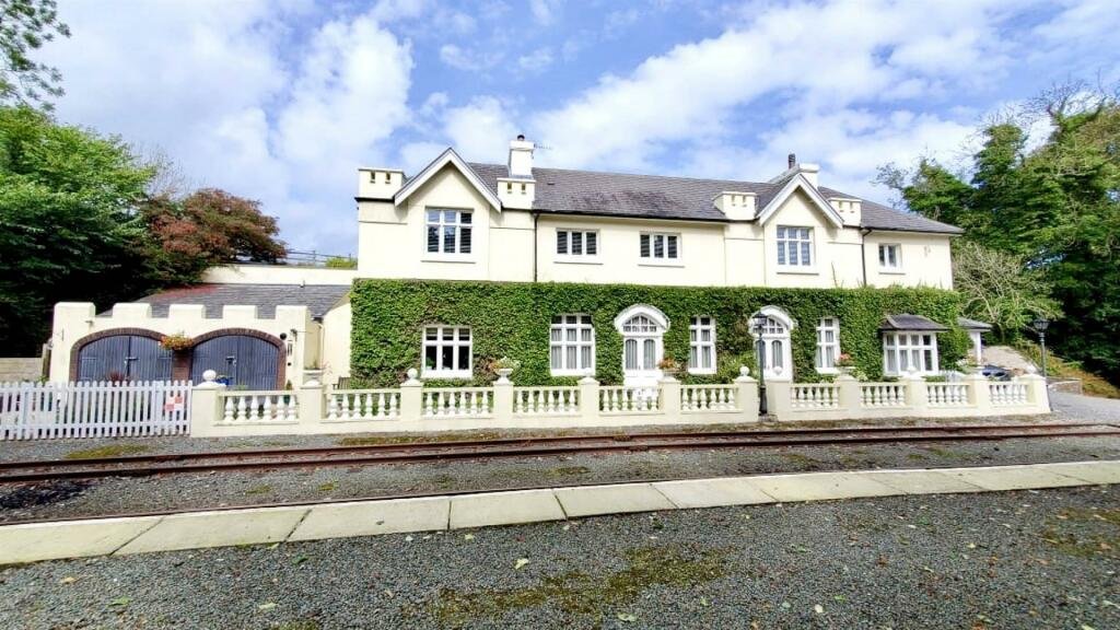 Former Isle of Man steam railway station built in 1874 goes on sale for £750,000, offering four bedrooms, historic charm and steam trains passing just yards away.