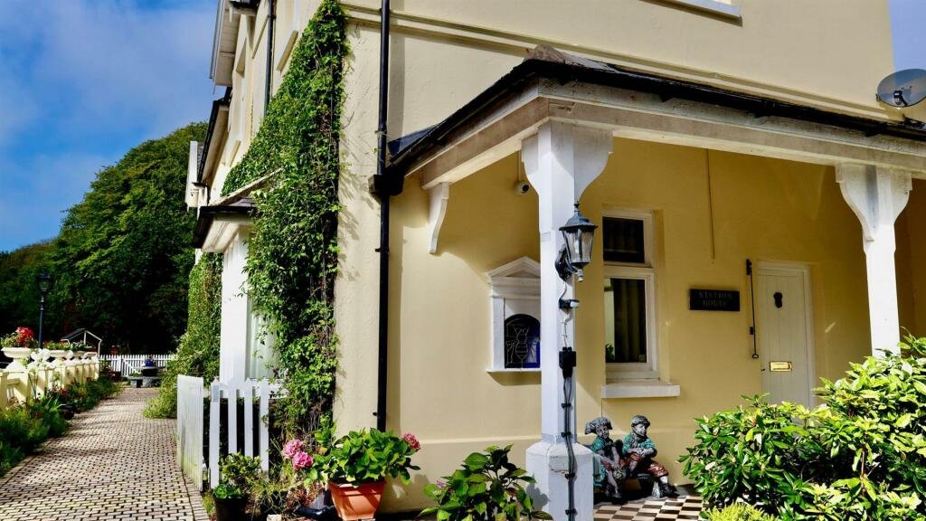 Former Isle of Man steam railway station built in 1874 goes on sale for £750,000, offering four bedrooms, historic charm and steam trains passing just yards away.