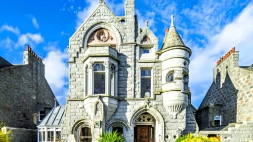 A stunning £1.5m pink granite storybook castle in Aberdeen hits the market offering eight bedrooms grand period details stained glass turrets and lavish interiors in a restored A listed home.