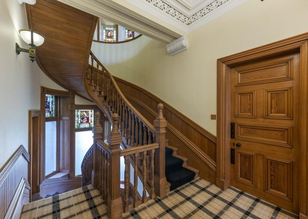 A stunning £1.5m pink granite storybook castle in Aberdeen hits the market offering eight bedrooms grand period details stained glass turrets and lavish interiors in a restored A listed home.