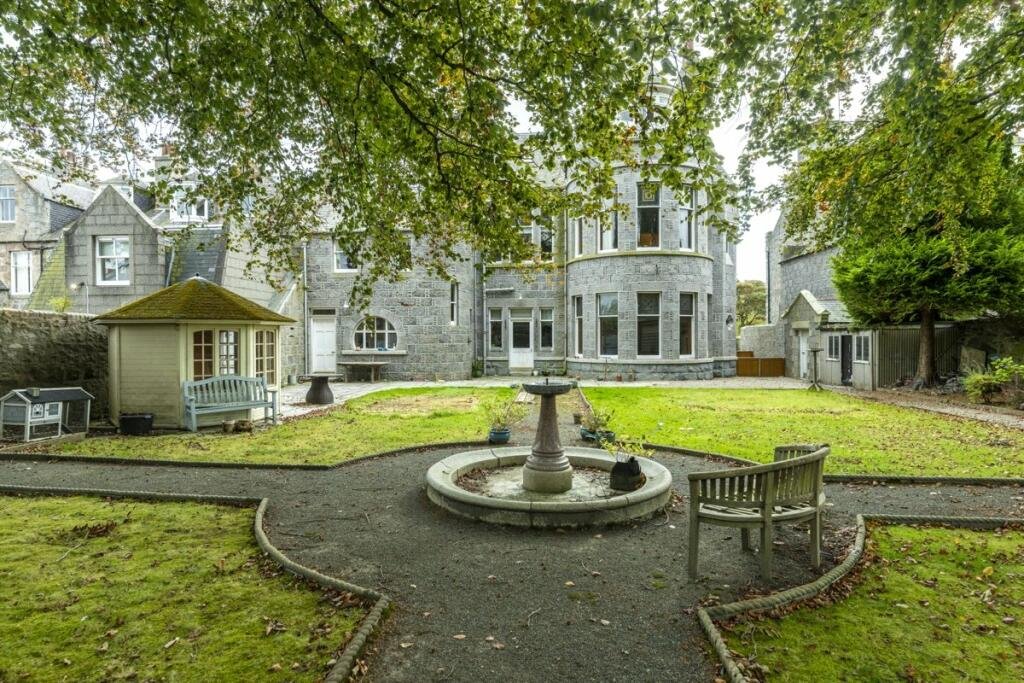A stunning £1.5m pink granite storybook castle in Aberdeen hits the market offering eight bedrooms grand period details stained glass turrets and lavish interiors in a restored A listed home.