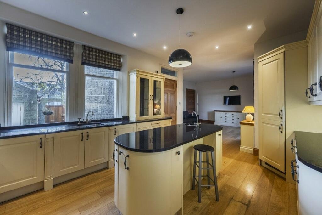 A stunning £1.5m pink granite storybook castle in Aberdeen hits the market offering eight bedrooms grand period details stained glass turrets and lavish interiors in a restored A listed home.