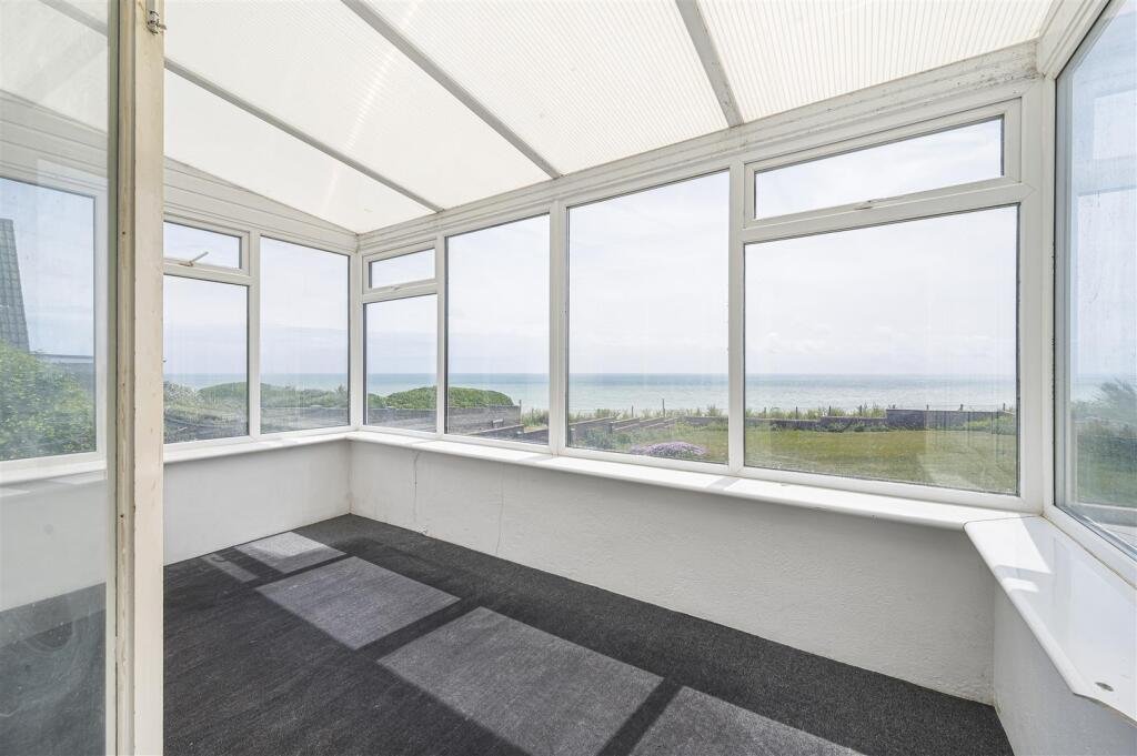 A £445,000 cliff top bungalow in Peacehaven offers stunning sea views and huge renovation potential on a 40 metre plot, despite nearby erosion concerns, making it a rare coastal project.