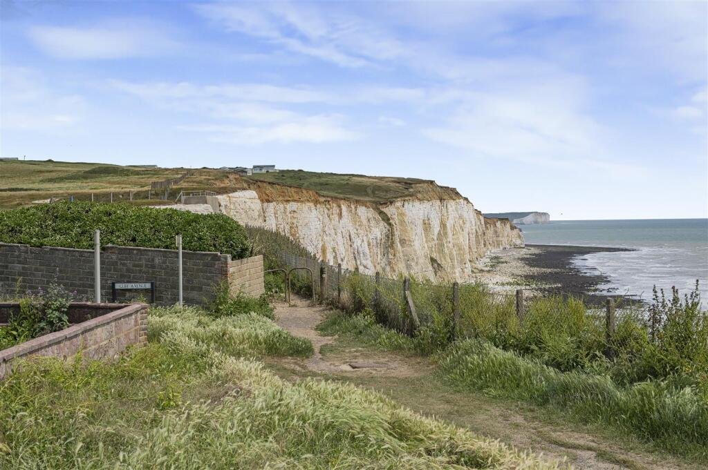 A £445,000 cliff top bungalow in Peacehaven offers stunning sea views and huge renovation potential on a 40 metre plot, despite nearby erosion concerns, making it a rare coastal project.