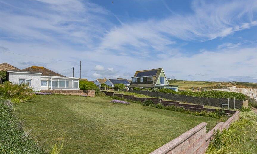 A £445,000 cliff top bungalow in Peacehaven offers stunning sea views and huge renovation potential on a 40 metre plot, despite nearby erosion concerns, making it a rare coastal project.