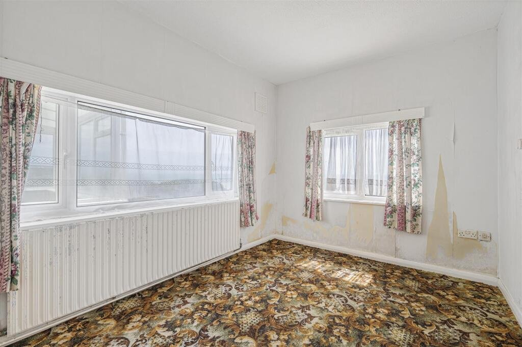 A £445,000 cliff top bungalow in Peacehaven offers stunning sea views and huge renovation potential on a 40 metre plot, despite nearby erosion concerns, making it a rare coastal project.