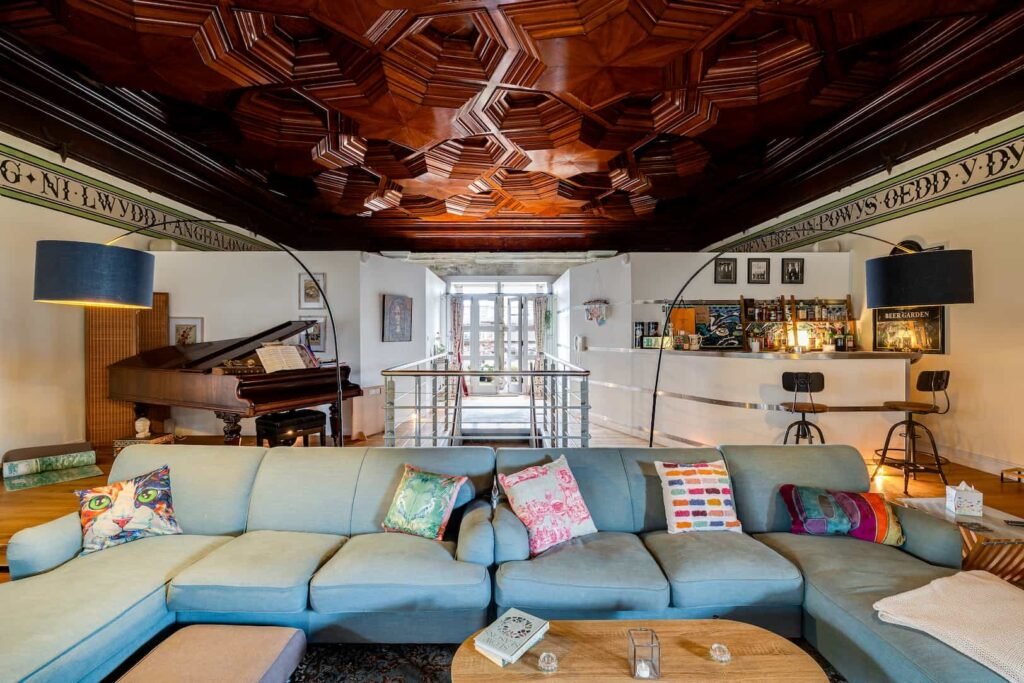 Fairytale Gothic mansion with Capability Brown gardens goes on sale for £700k offering dramatic halls secret rooms private cinema bar and historic charm in Wales.