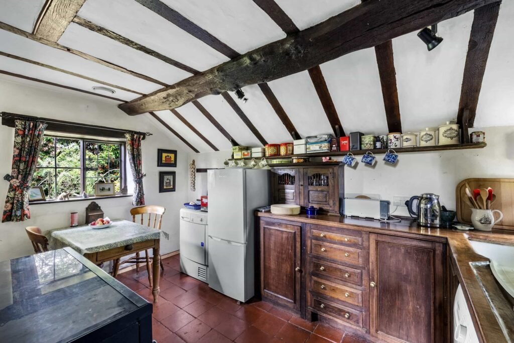 A £350,000 fairytale cottage rebuilt stone by stone in a picturesque village is for sale, offering beams, cosy charm, gardens, a pond and idyllic countryside living in Yarpole.