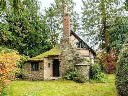 A £350,000 fairytale cottage rebuilt stone by stone in a picturesque village is for sale, offering beams, cosy charm, gardens, a pond and idyllic countryside living in Yarpole.