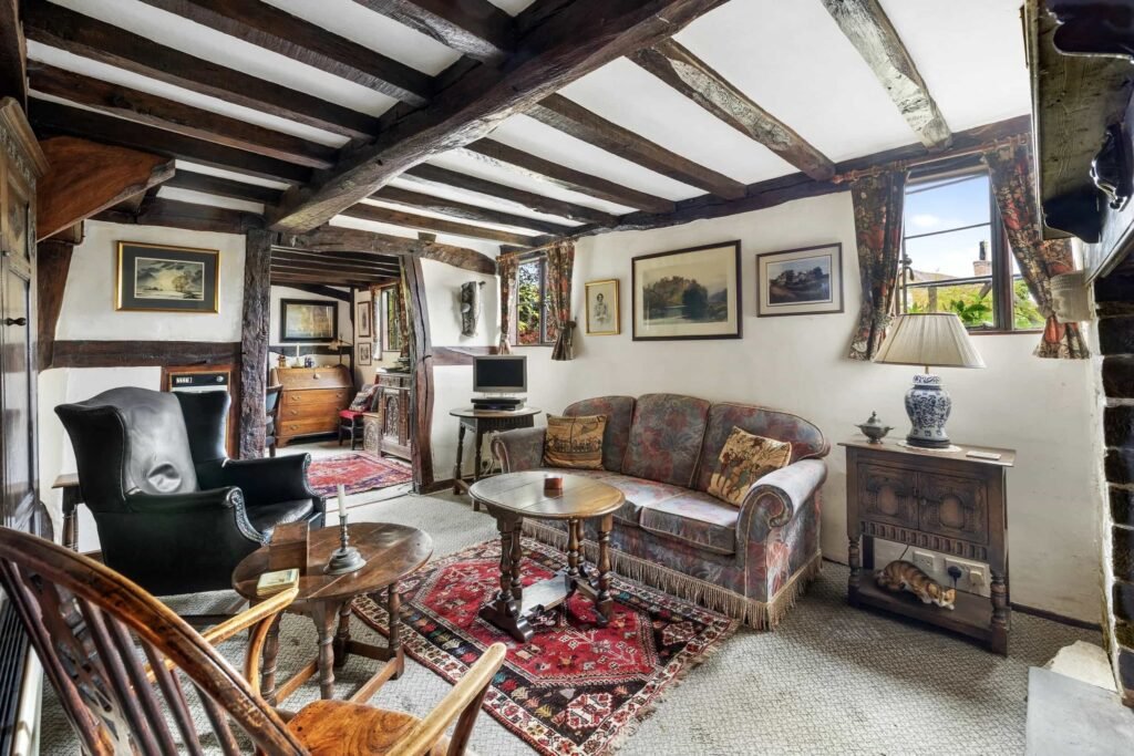 A £350,000 fairytale cottage rebuilt stone by stone in a picturesque village is for sale, offering beams, cosy charm, gardens, a pond and idyllic countryside living in Yarpole.