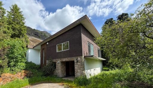 1970s time capsule home hits the market for £255,000, offering five bedrooms, retro charm and huge renovation potential in rural Powys village with gardens and garage for buyers seeking.