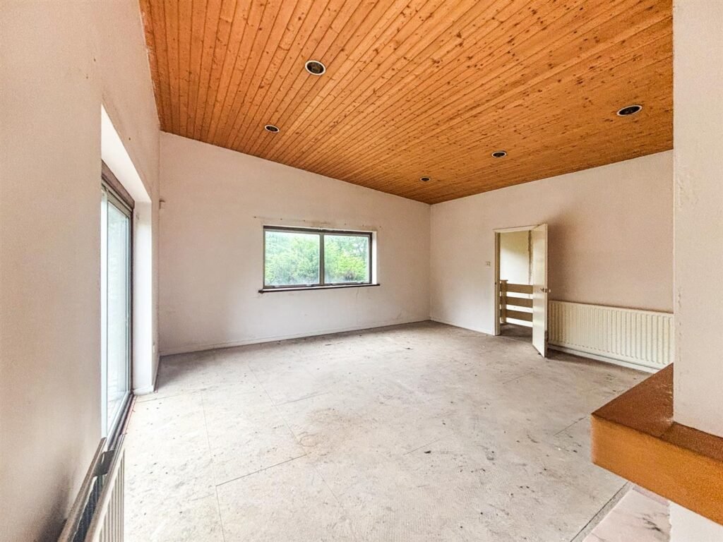 1970s time capsule home hits the market for £255,000, offering five bedrooms, retro charm and huge renovation potential in rural Powys village with gardens and garage for buyers seeking.