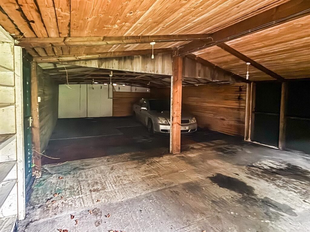 1970s time capsule home hits the market for £255,000, offering five bedrooms, retro charm and huge renovation potential in rural Powys village with gardens and garage for buyers seeking.