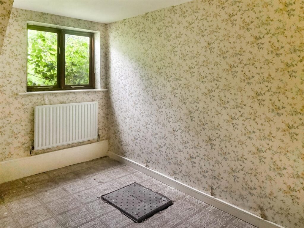 1970s time capsule home hits the market for £255,000, offering five bedrooms, retro charm and huge renovation potential in rural Powys village with gardens and garage for buyers seeking.