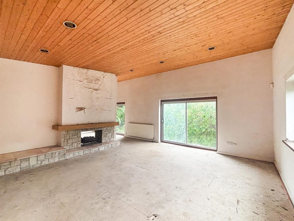 1970s time capsule home hits the market for £255,000, offering five bedrooms, retro charm and huge renovation potential in rural Powys village with gardens and garage for buyers seeking.