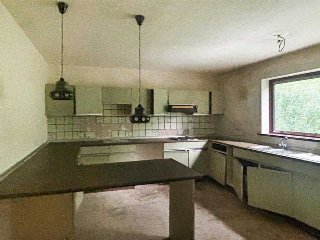 1970s time capsule home hits the market for £255,000, offering five bedrooms, retro charm and huge renovation potential in rural Powys village with gardens and garage for buyers seeking.