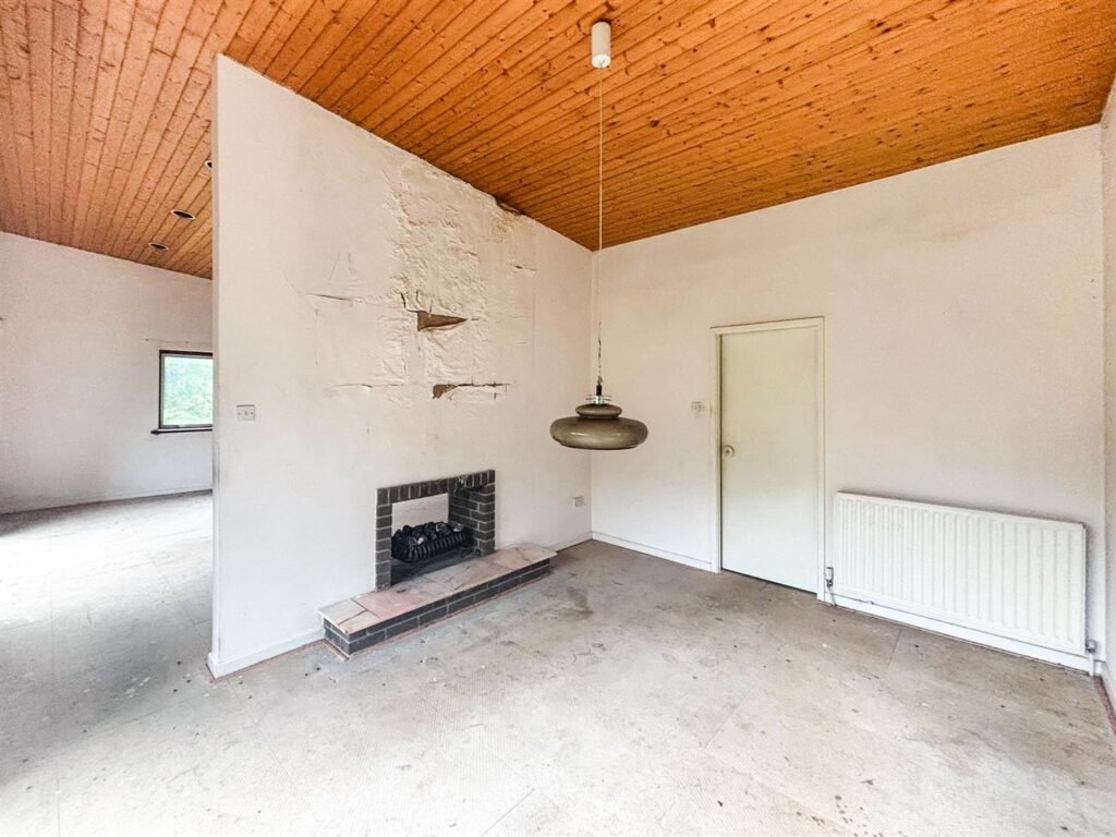 1970s time capsule home hits the market for £255,000, offering five bedrooms, retro charm and huge renovation potential in rural Powys village with gardens and garage for buyers seeking.