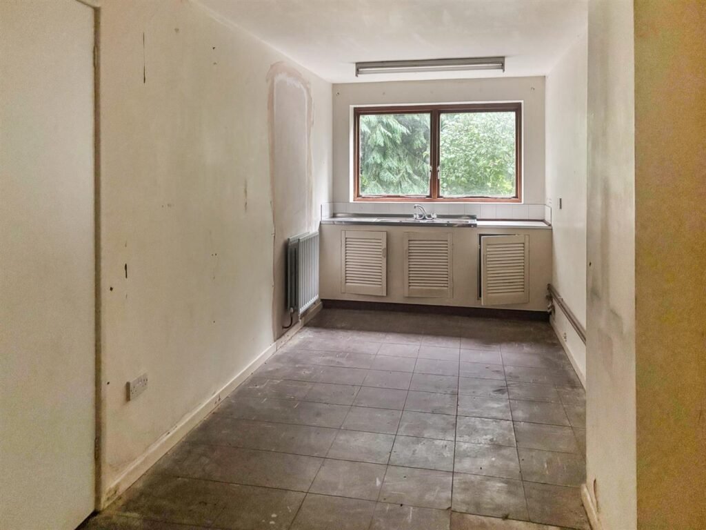 1970s time capsule home hits the market for £255,000, offering five bedrooms, retro charm and huge renovation potential in rural Powys village with gardens and garage for buyers seeking.