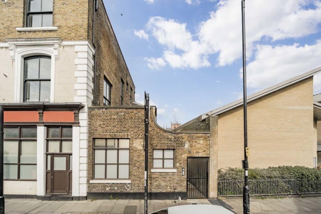 A £450000 London flat sparks attention with steep ladder style beds raised above furniture-offering a quirky space saving layout in a modern Finsbury Park apartment.