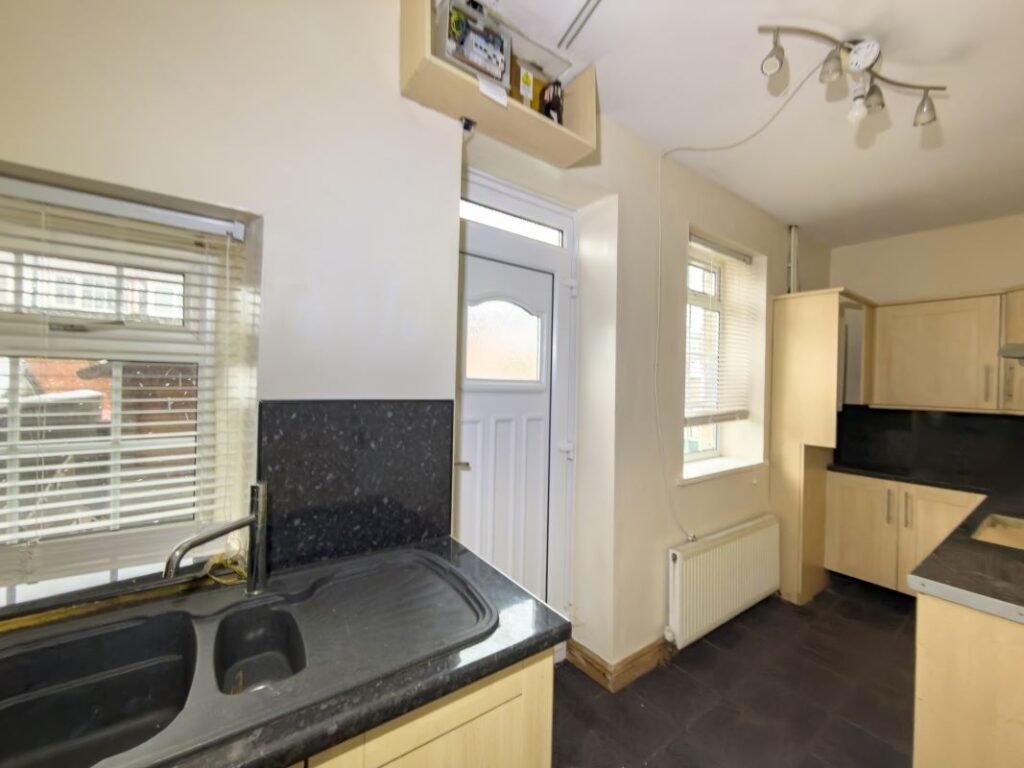A quirky £80000 Burnopfield home hits auction featuring a bizarre bathroom with a toilet between two basins plus a spa bath fireplace lounge and garden in a village near Newcastle.