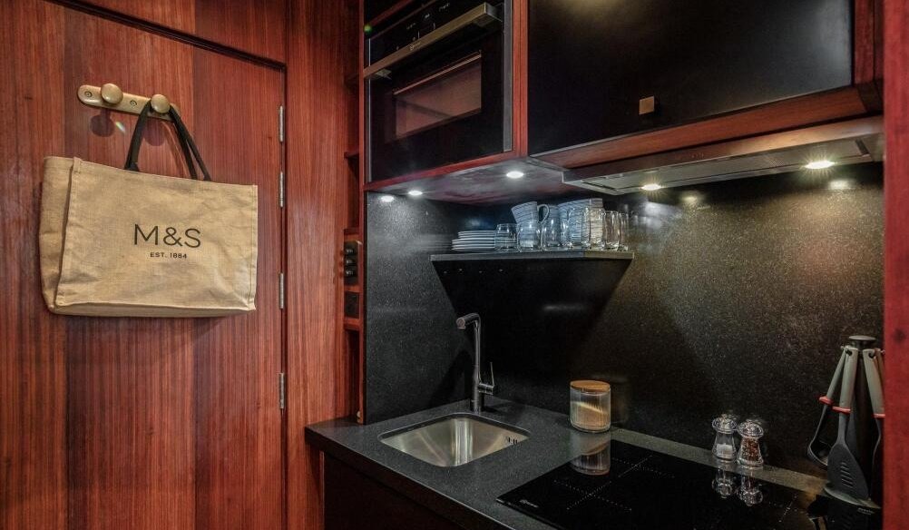 London studio flat smaller than a train carriage hits the market for £294,900, featuring ladder bed, fold-away furniture and full kitchen in Pimlico, central prime London.