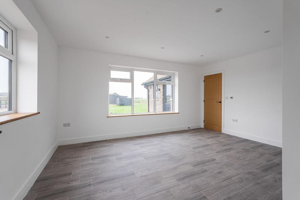 Renovated three bed countryside home near Cambridge lists for £600,000 with 5.5 acres of grassland, huge potential, planning permission and stunning open views.