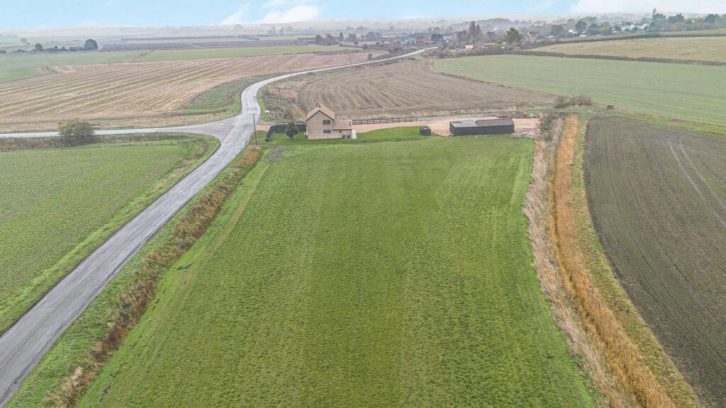 Renovated three bed countryside home near Cambridge lists for £600,000 with 5.5 acres of grassland, huge potential, planning permission and stunning open views.