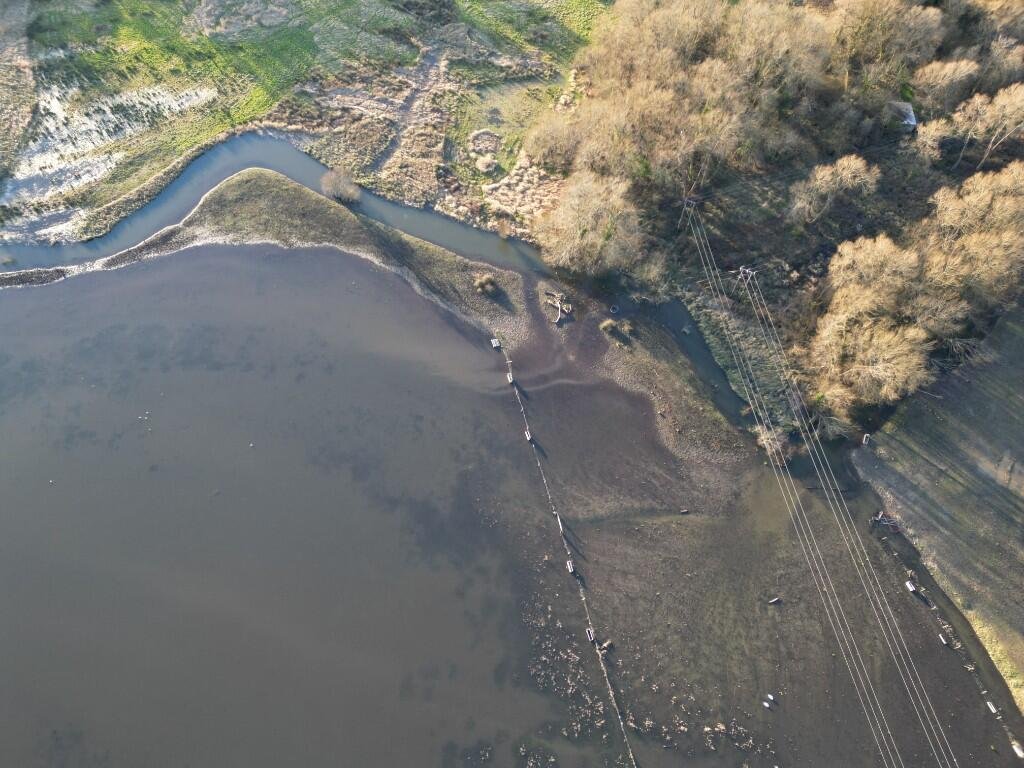 Six acres of flood-prone land beside the River Meon is for sale at £250,000, with buyers warned to bring waders as much of the soggy field sits underwater each winter no.