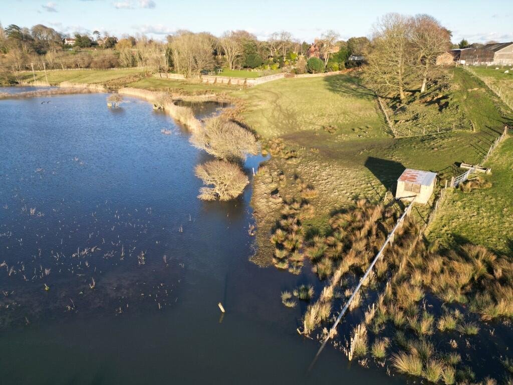 Six acres of flood-prone land beside the River Meon is for sale at £250,000, with buyers warned to bring waders as much of the soggy field sits underwater each winter no.