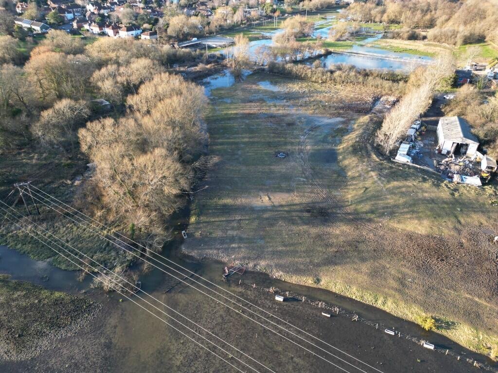Six acres of flood-prone land beside the River Meon is for sale at £250,000, with buyers warned to bring waders as much of the soggy field sits underwater each winter no.