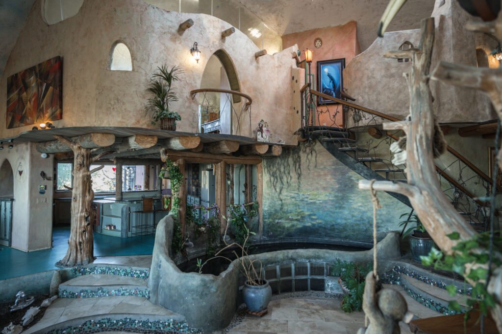 A whimsical pink dome home inspired by rainforests and desert landscapes has gone on sale for £1.2m, offering eco luxury, yoga domes and magical interiors in New Mexico