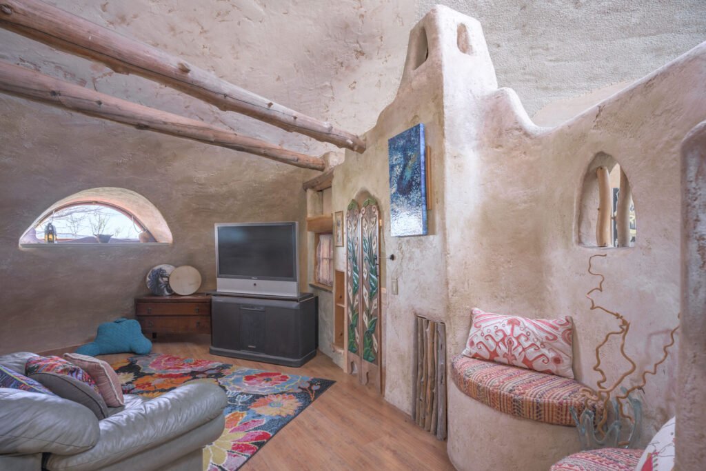 A whimsical pink dome home inspired by rainforests and desert landscapes has gone on sale for £1.2m, offering eco luxury, yoga domes and magical interiors in New Mexico