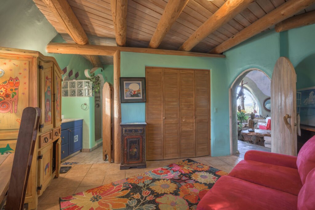 A whimsical pink dome home inspired by rainforests and desert landscapes has gone on sale for £1.2m, offering eco luxury, yoga domes and magical interiors in New Mexico