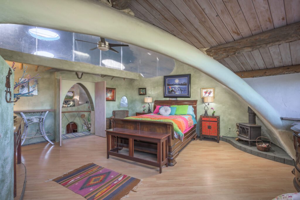 A whimsical pink dome home inspired by rainforests and desert landscapes has gone on sale for £1.2m, offering eco luxury, yoga domes and magical interiors in New Mexico
