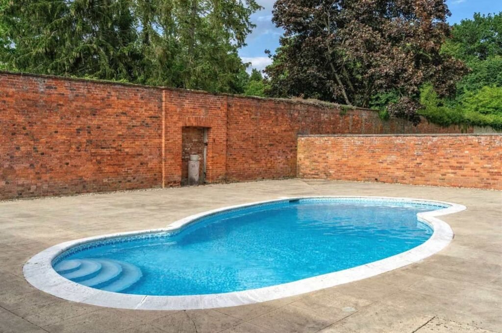 The last home built by Sir Edwin Lutyens, complete with a private cricket pitch and pavilion, goes up for sale after a £3m cut, now priced at £15m