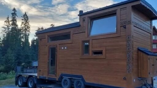 Off grid ready tiny all wood home with ultra low running costs goes on sale for £24,500 in London, featuring kitchen, bathroom, water tank and multiple living uses.
