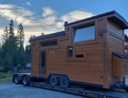 Off grid ready tiny all wood home with ultra low running costs goes on sale for £24,500 in London, featuring kitchen, bathroom, water tank and multiple living uses.