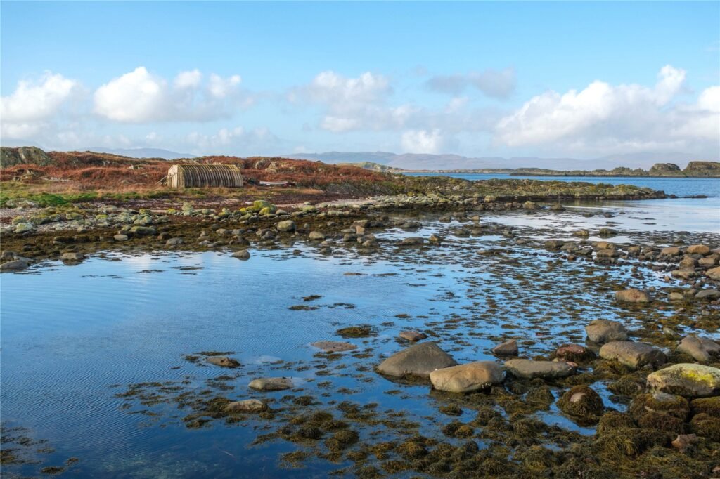 Stunning Scottish island with boathouse and sweeping sea views goes on sale for £50,000, but buyers are warned access is dangerous due to fast changing tides