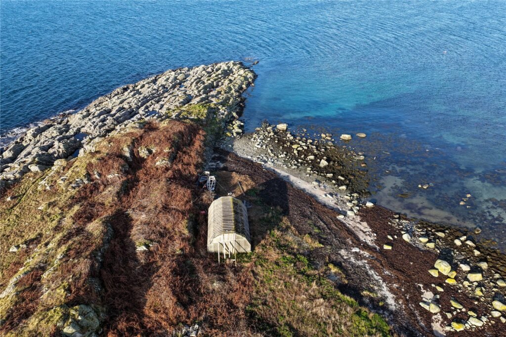 Stunning Scottish island with boathouse and sweeping sea views goes on sale for £50,000, but buyers are warned access is dangerous due to fast changing tides
