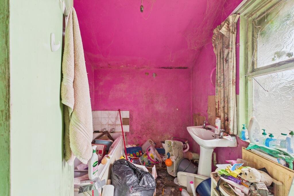 A rubbish-filled three-bed house with collapsed ceilings and unsafe floors has hit the market for £125,000, but buyers must bid blind as council rules ban entry