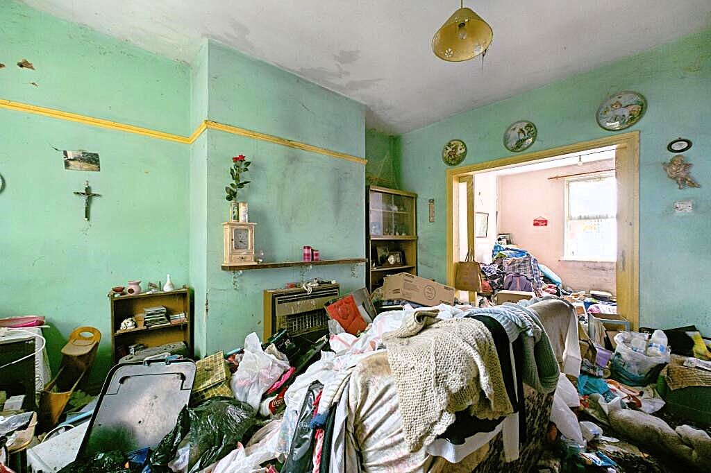 A rubbish-filled three-bed house with collapsed ceilings and unsafe floors has hit the market for £125,000, but buyers must bid blind as council rules ban entry