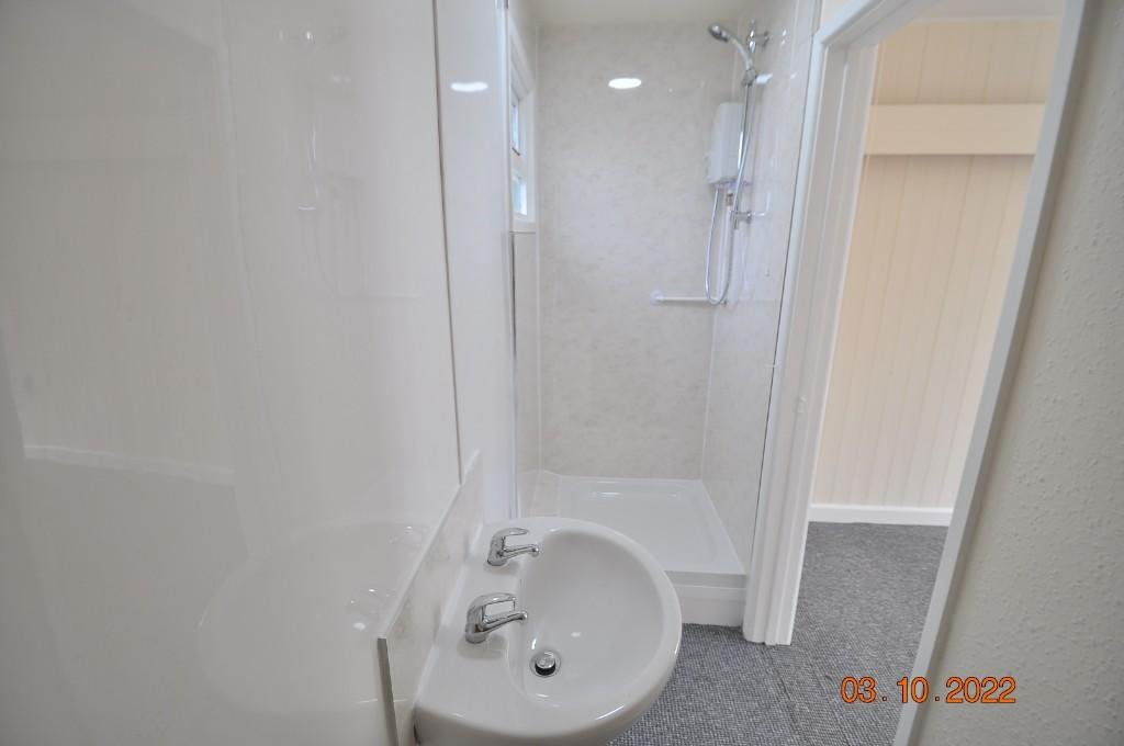 Tiny studio flat squeezed beside a homeowner’s front door hits the rental market for £675 a month, with all bills included and one parking space despite its porch like size