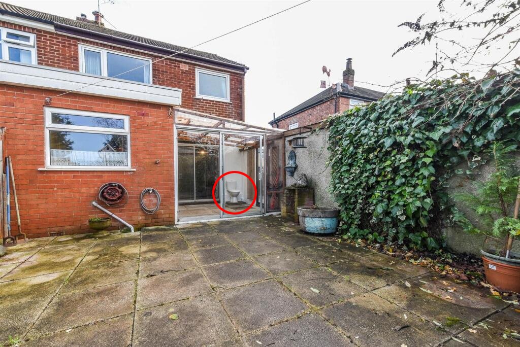 A three bedroom home priced at £130,000 has caught attention for its unusual layout, featuring a fully plumbed toilet sitting openly inside a glass conservatory