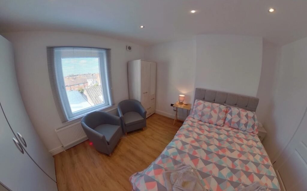 A £920 a month studio flat sparks shock after revealing a full kitchen hidden inside a cupboard at the foot of the bed, cramming living, dining and cooking into one tiny space.