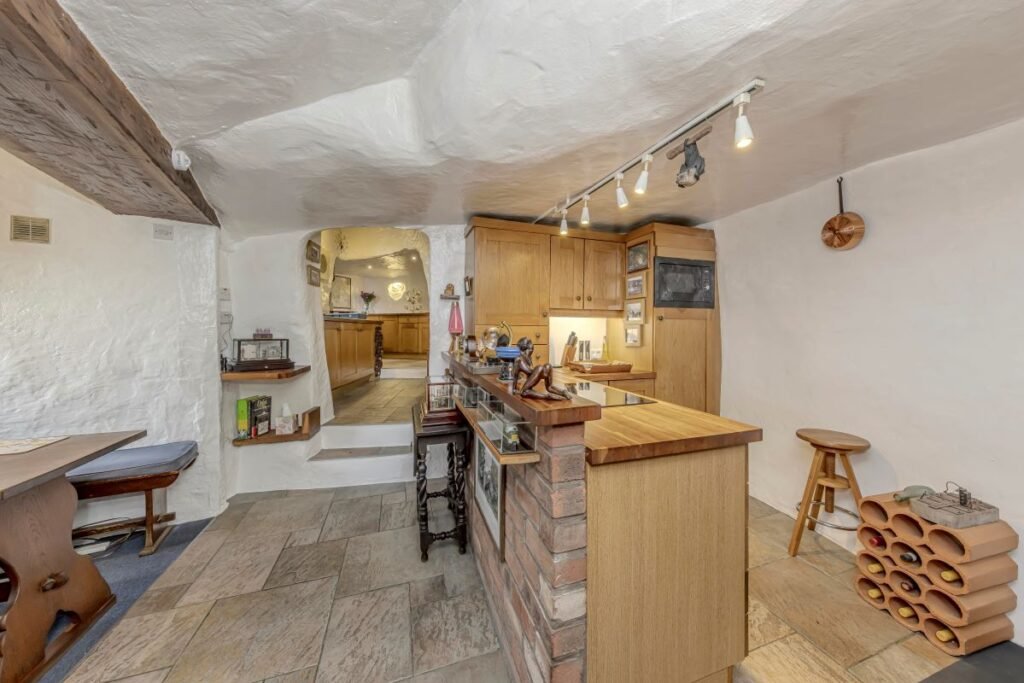 Dating back to 1511, this rare sandstone cave cottage with a bedroom carved into rock is for sale at £525,000, set in 2.5 acres near Kidderminster. Worcestershire UK sale