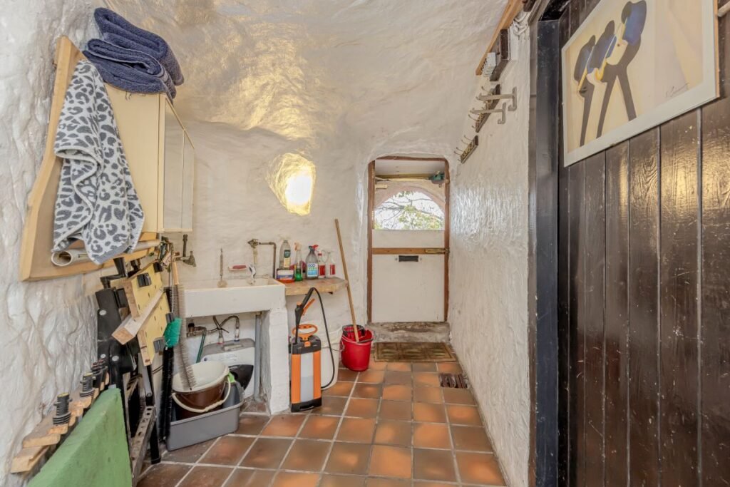 Dating back to 1511, this rare sandstone cave cottage with a bedroom carved into rock is for sale at £525,000, set in 2.5 acres near Kidderminster. Worcestershire UK sale