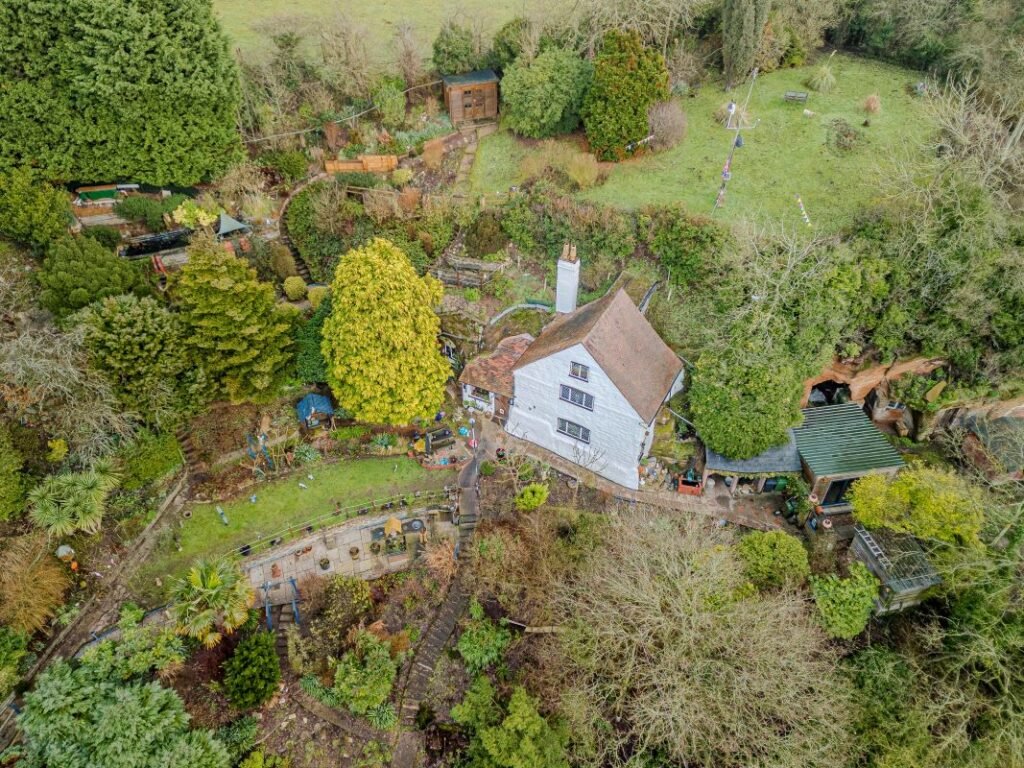 Dating back to 1511, this rare sandstone cave cottage with a bedroom carved into rock is for sale at £525,000, set in 2.5 acres near Kidderminster. Worcestershire UK sale